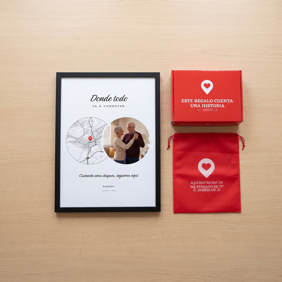 Cuadro Donde todo va a comenzar personalizado (Donde todo · VA A COMENZAR · Cuarenta años después, seguimos aquí · BURGOS) junto a la caja roja y la bolsa de tela roja en que se envía