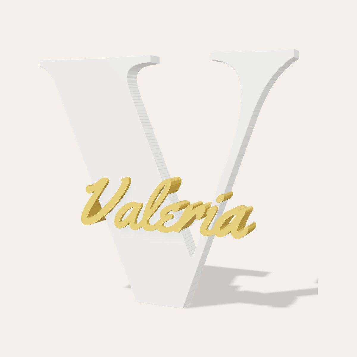 Letra 3D V blanca con el nombre Valeria en relieve dorado