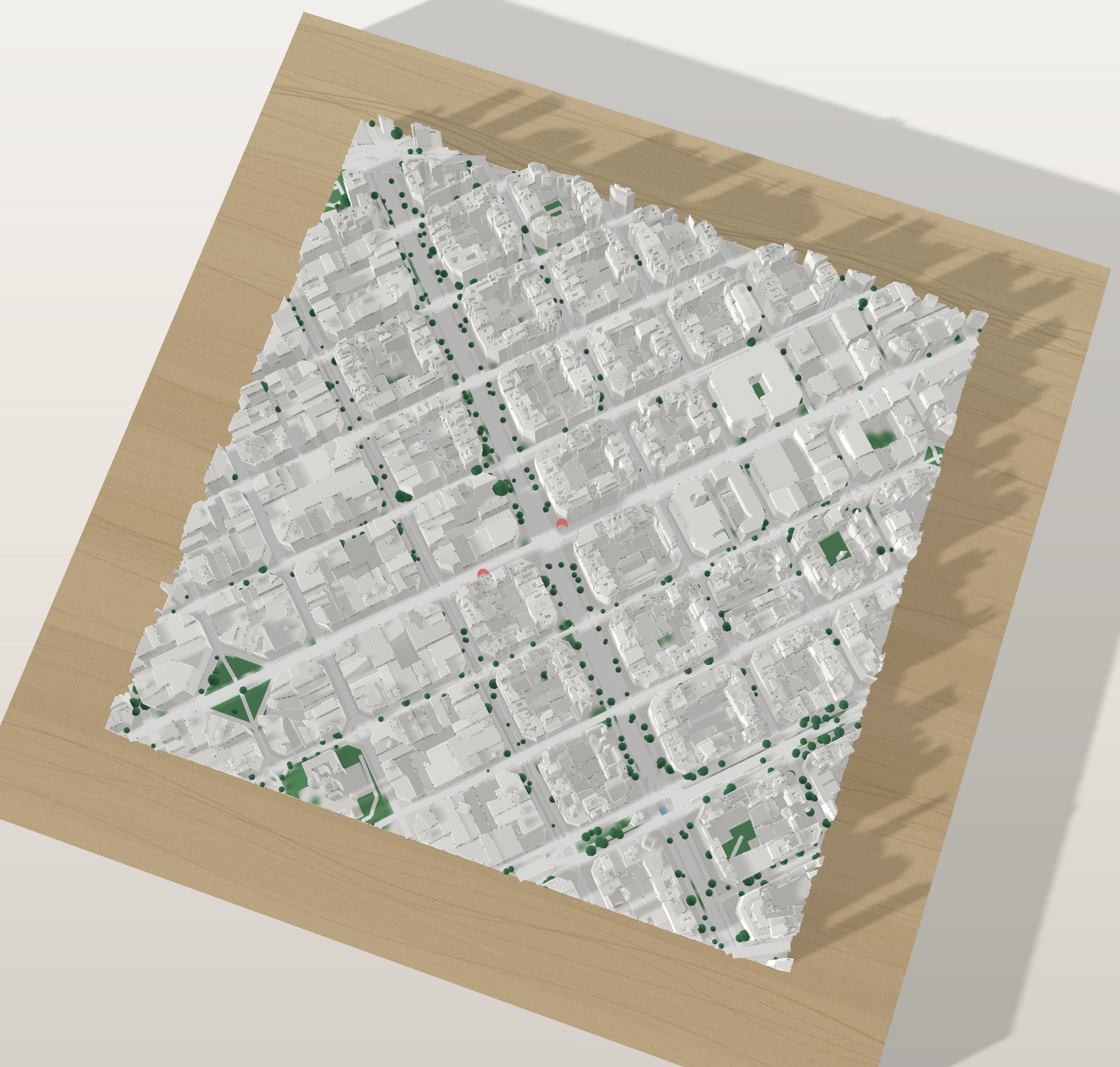 Vista cenital del mapa 3D con dos marcadores rojos señalando edificios concretos