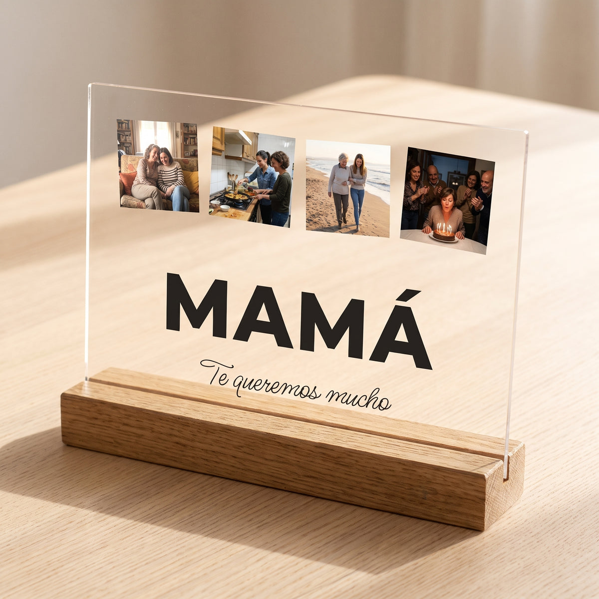 Placa de metacrilato personalizada con la palabra y cuatro fotos encajada en su base de roble, con la luz apagada